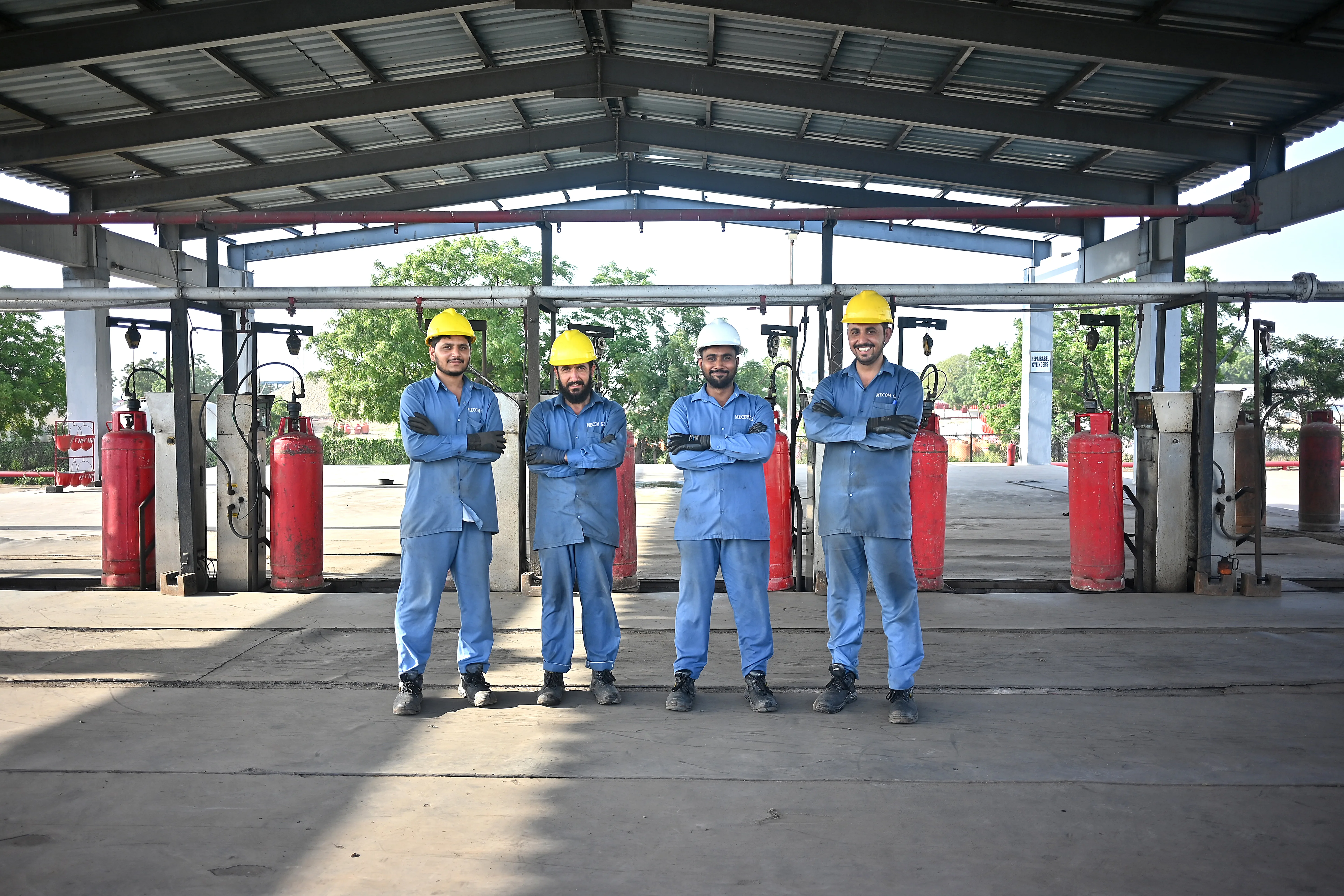 Mecom Gas workers in industrial facility